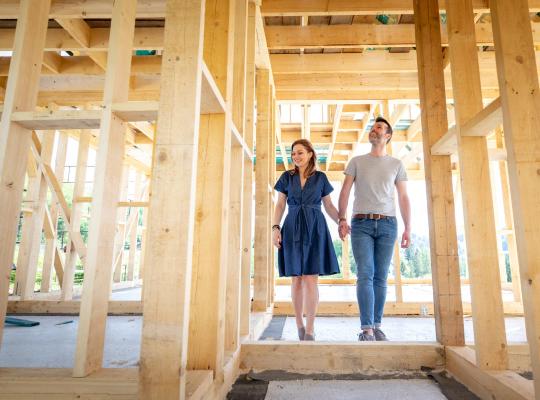 couple walking through house