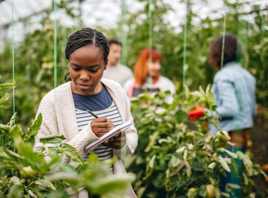 black student studying plants
